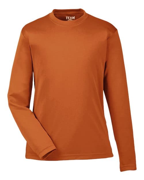 FLG Lacrosse Sport Burnt Orange Youth Zone Performance Long Sleeve T-Shirt, with the Block Be You — Navy & White design, on the full chest, front view